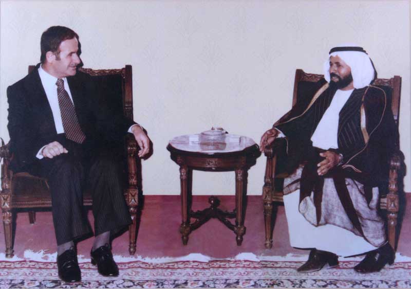 H.H Rashed bin Aweidha (right) with former President of Syria Hafez al-Assad